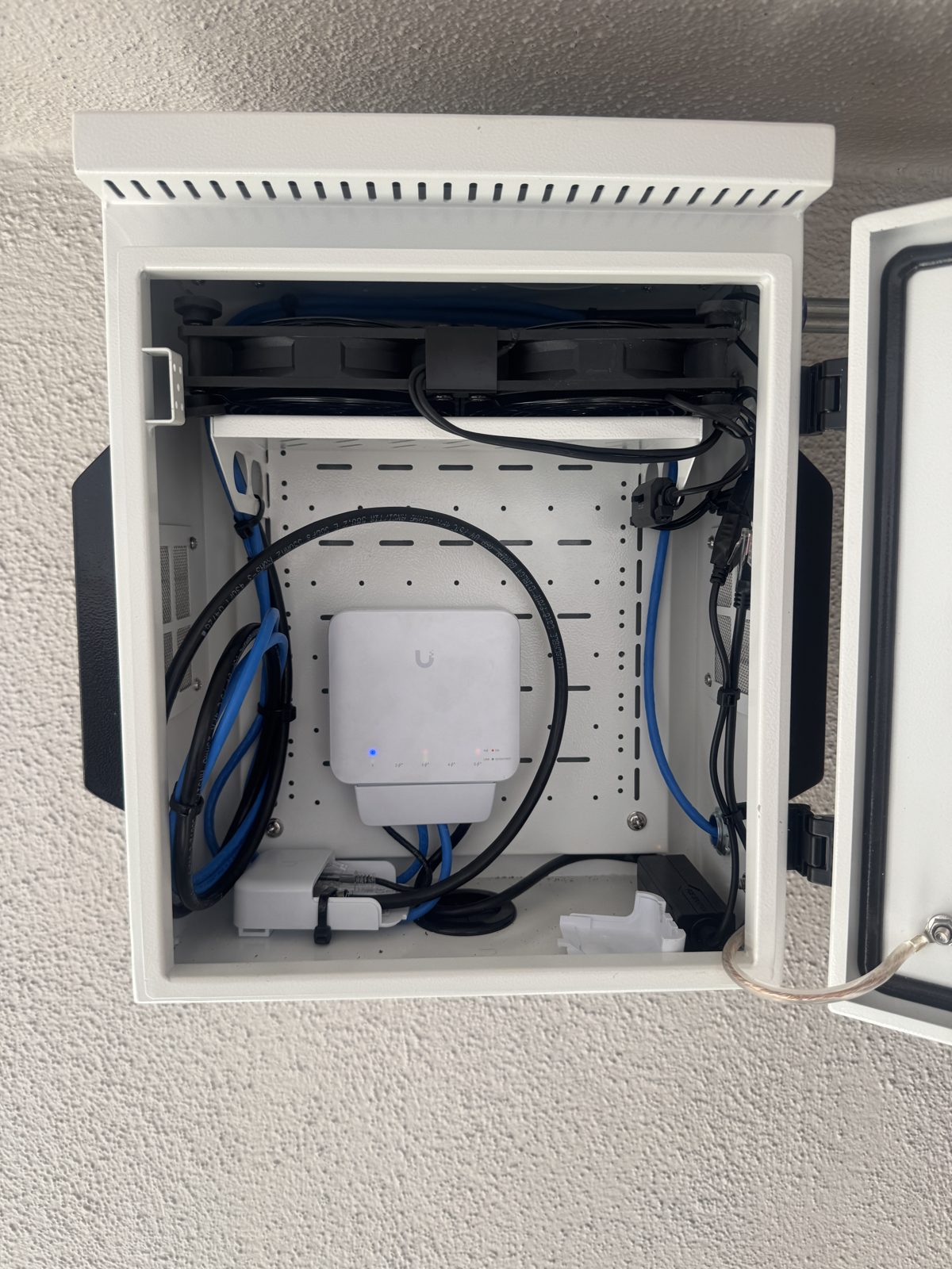UniFi network cabinet cleanly installed at a Los Angeles apartment building