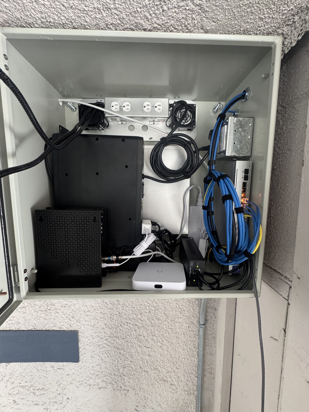 Network and PoE enclosure for a multifamily security system